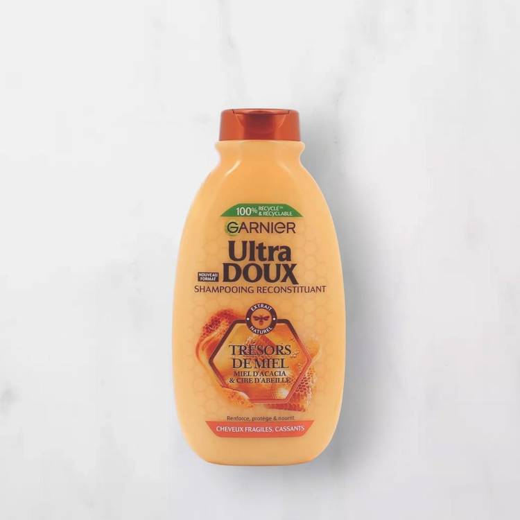 Le Shampoing reconstituant miel  "Garnier"