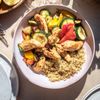 Les Aiguillettes de poulet mariné et quinoa aux légumes
