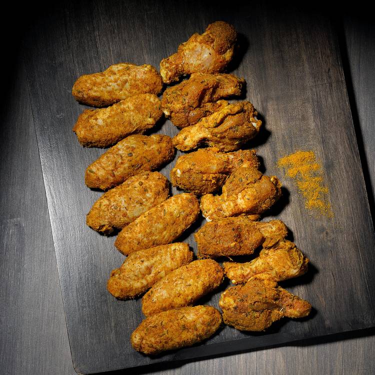 Les Ailes de poulet marinées au curry